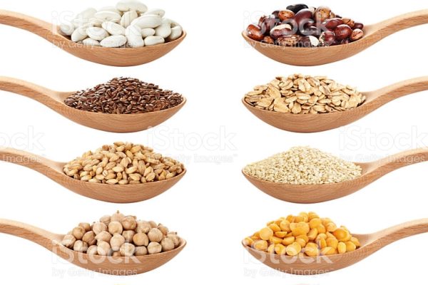 Wooden spoon with porridge, cereals, lentils, peas and beans isolated on white background. Collection.