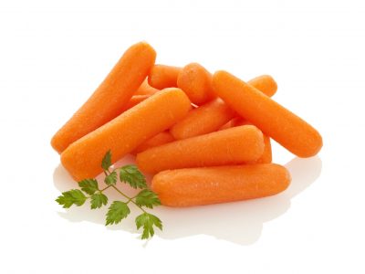 Heap of raw baby carrots isolated on white background